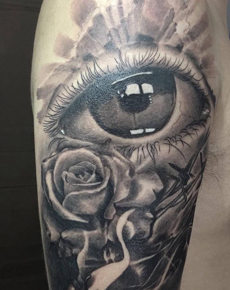 欧美花臂纹身图片_手臂欧美写实眼睛玫瑰花蜡烛纹身图案