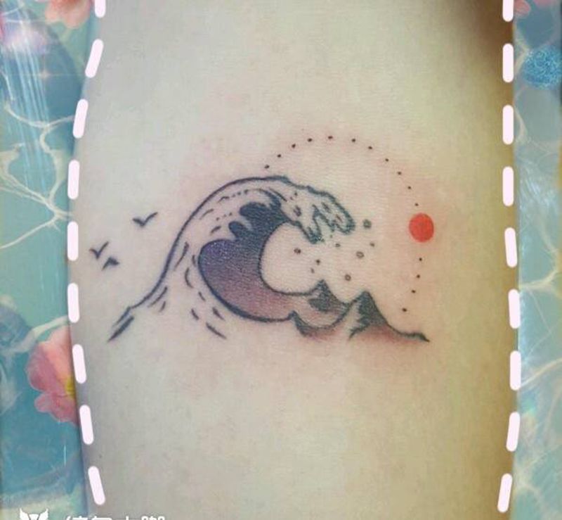 旭日东升纹身图片_手臂纹身图案