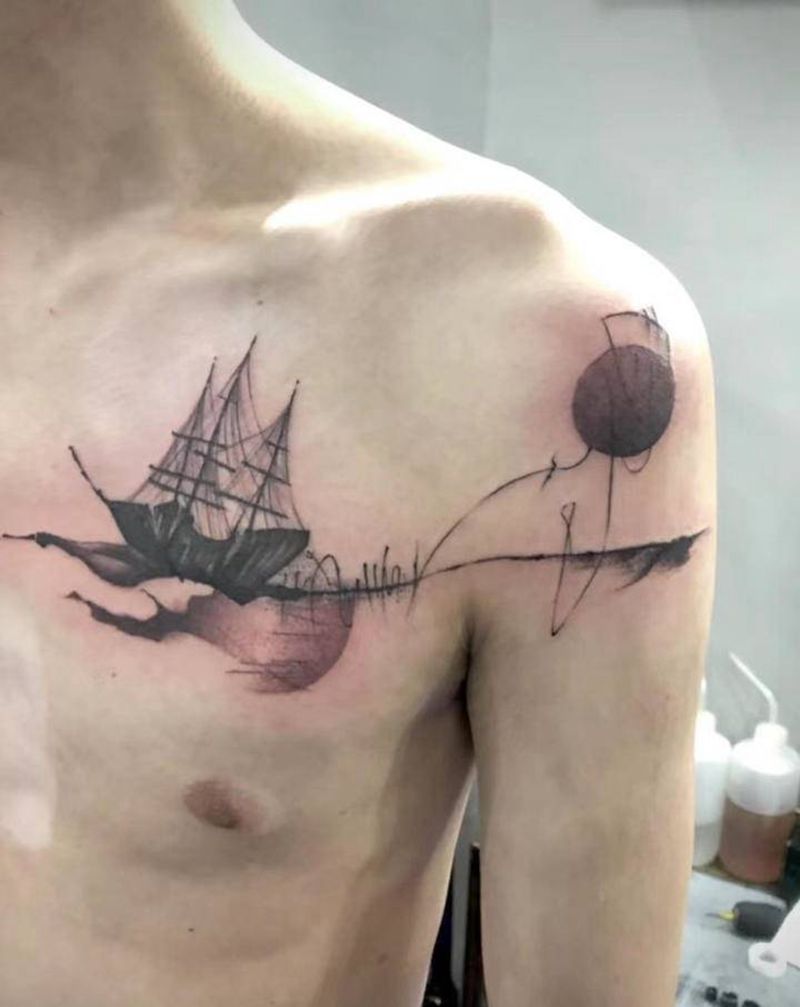 搁浅的小船纹身图片_胸部纹身图案