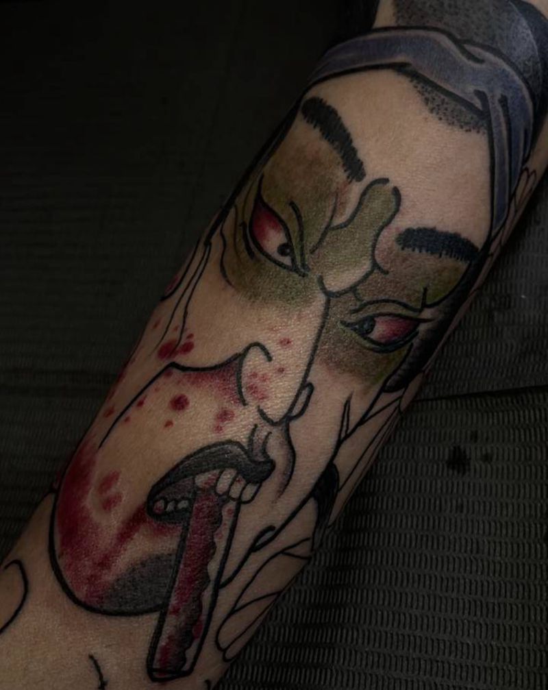 生首未完纹身图片_手臂老传统纹身图案