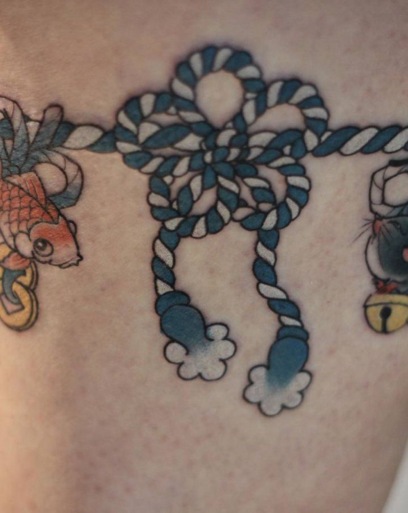 招财四宝纹身图片_腿部纹身图案