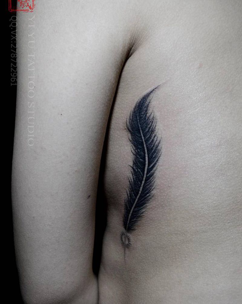 羽毛纹身图片_腰部纹身图案