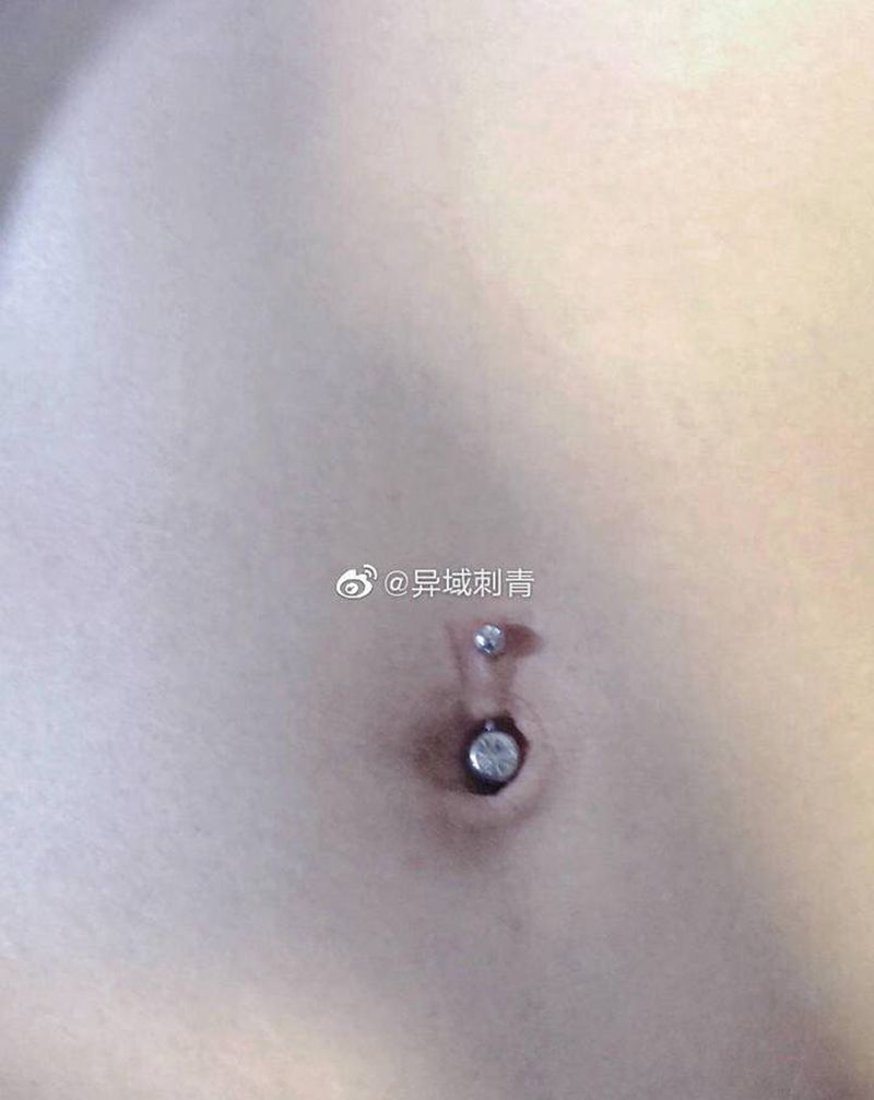 穿孔纹身图片_腹部纹身图案