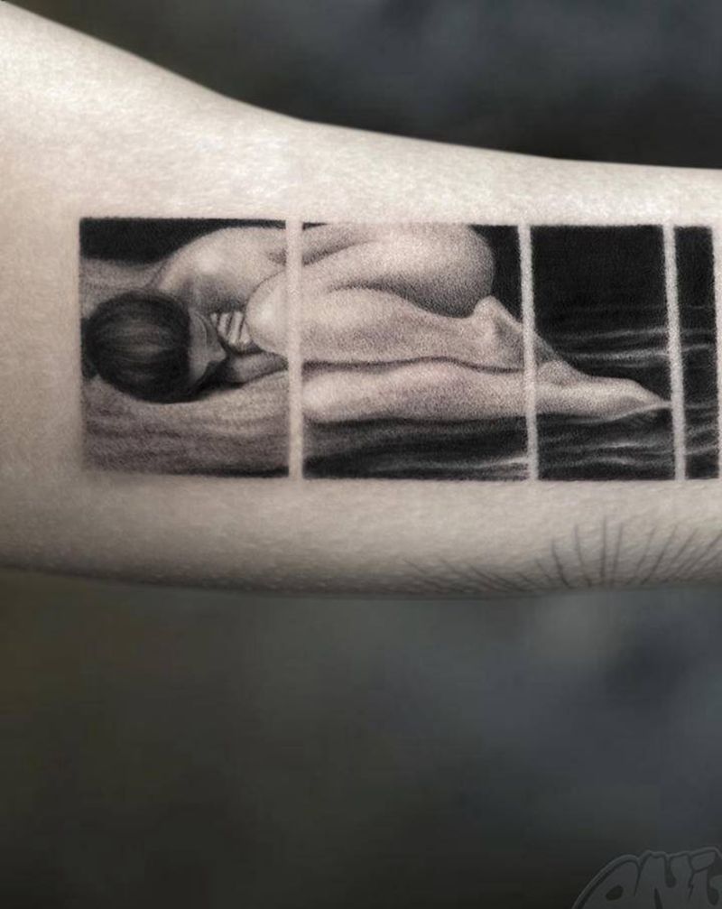 躺在水岸上的女人纹身图片_手臂欧美写实纹身图案