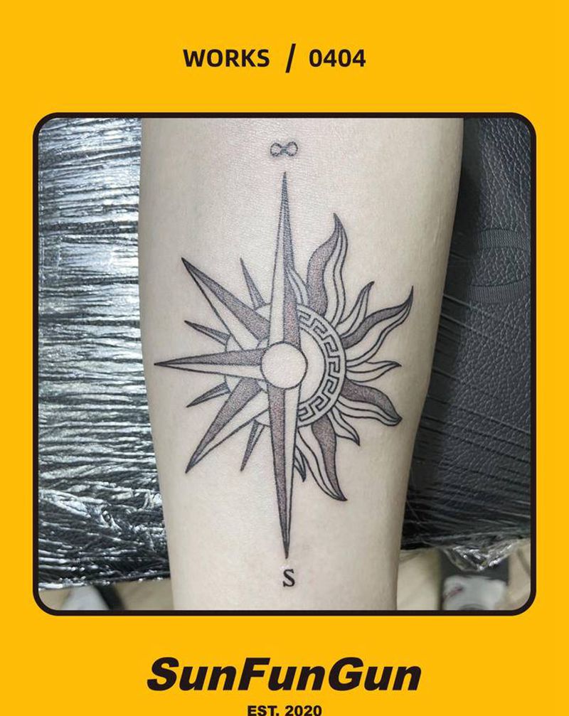 太阳纹身图片_手臂点刺指南针太阳纹身图案