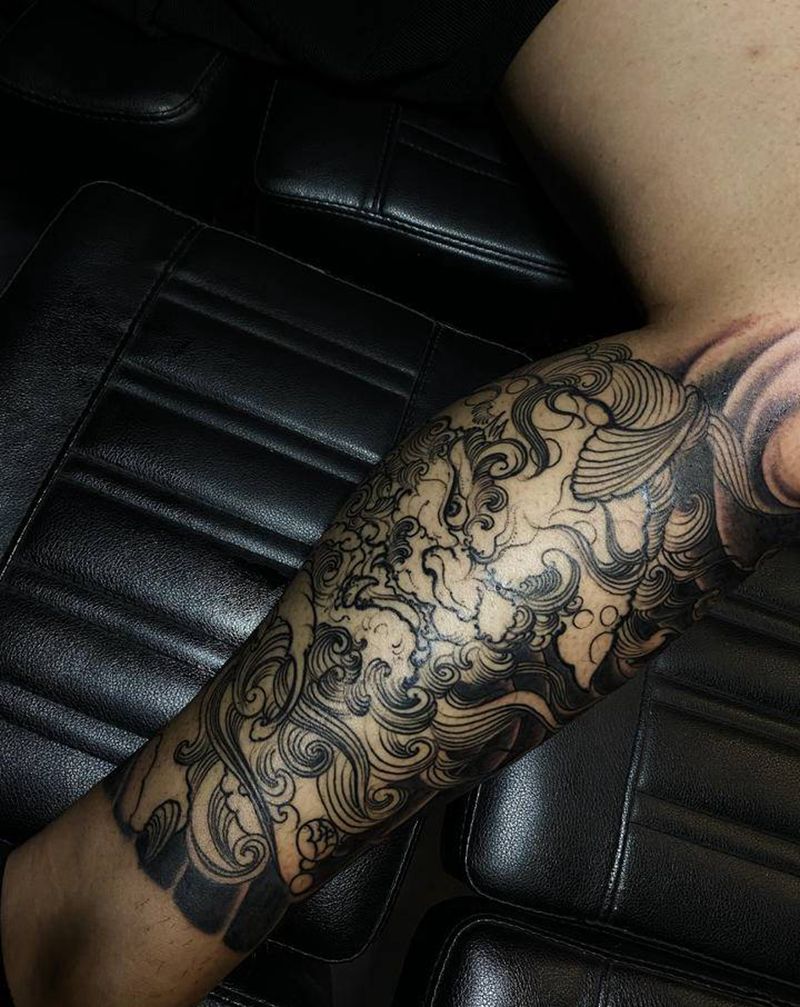 唐狮子包腿纹身图片_腿部新传统纹身图案