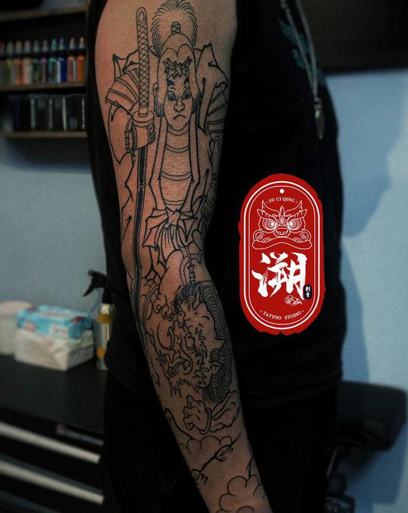 桃太郎打鬼纹身图片_手臂手部老传统花臂纹身图案