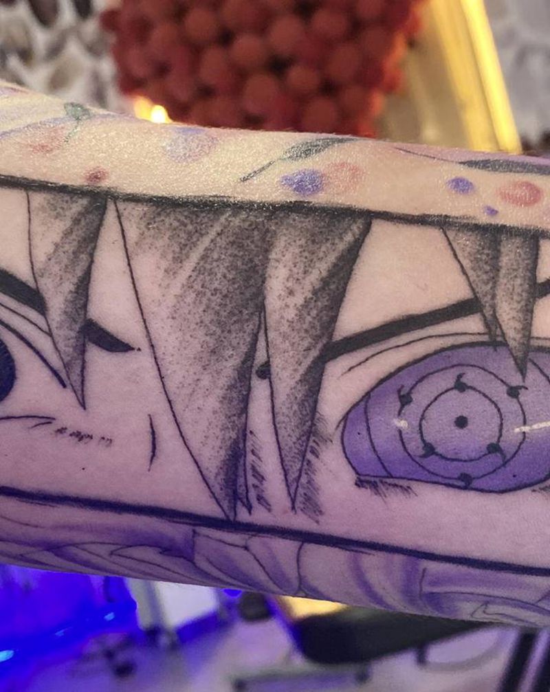 轮回眼佐助纹身图片_手臂水彩水墨纹身图案