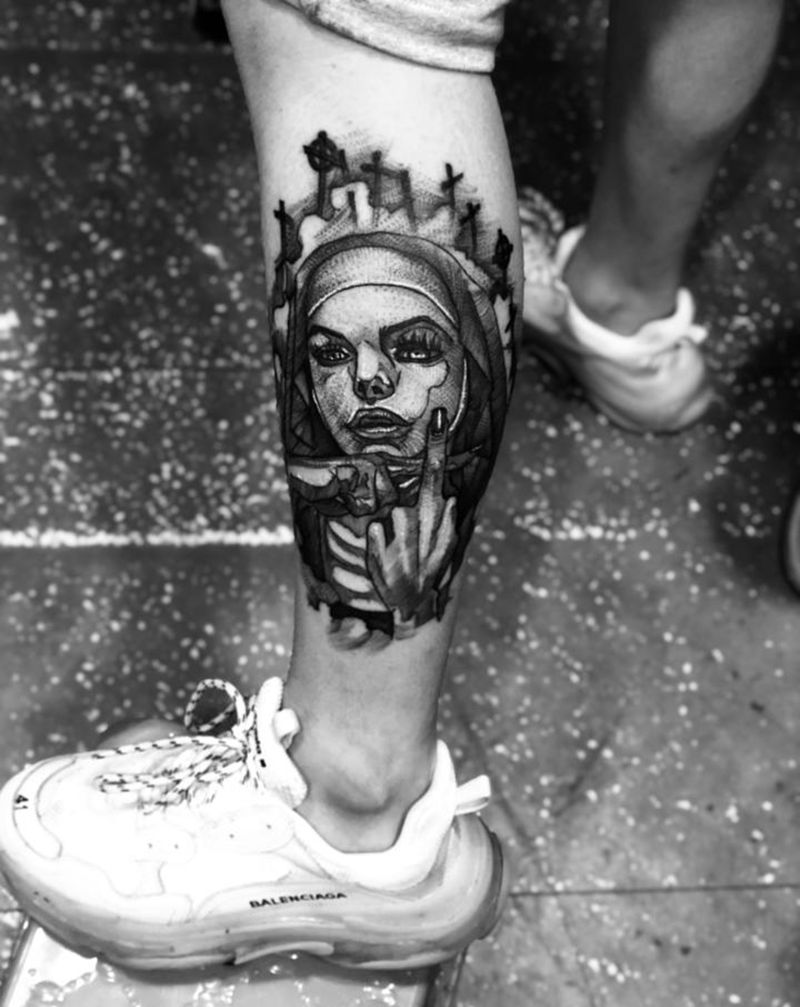 修女纹身纹身图片_腿部点刺纹身图案