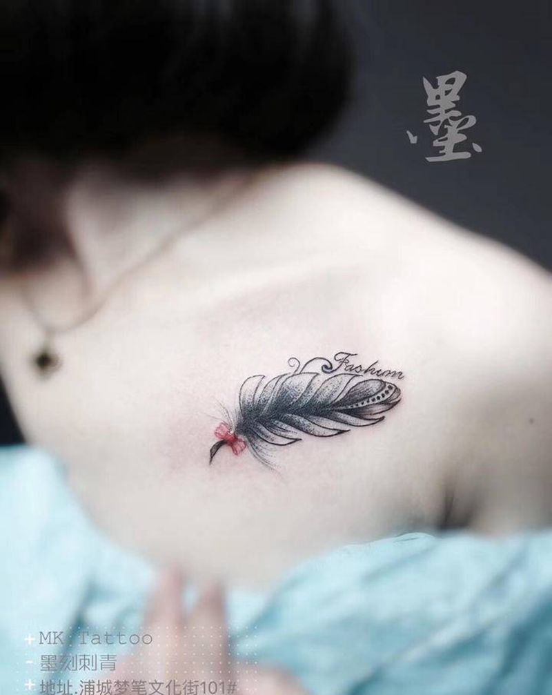 羽纹身图片_胸部纹身图案