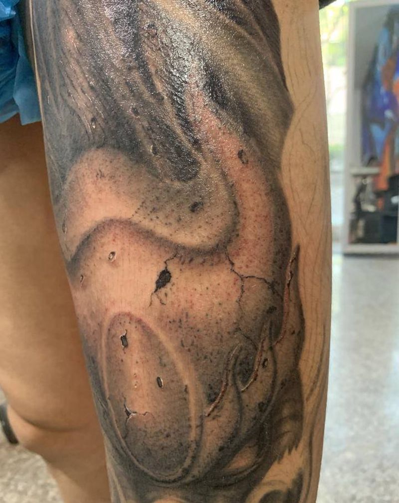 石雕龙腿纹身图片_腿部欧美写实纹身图案