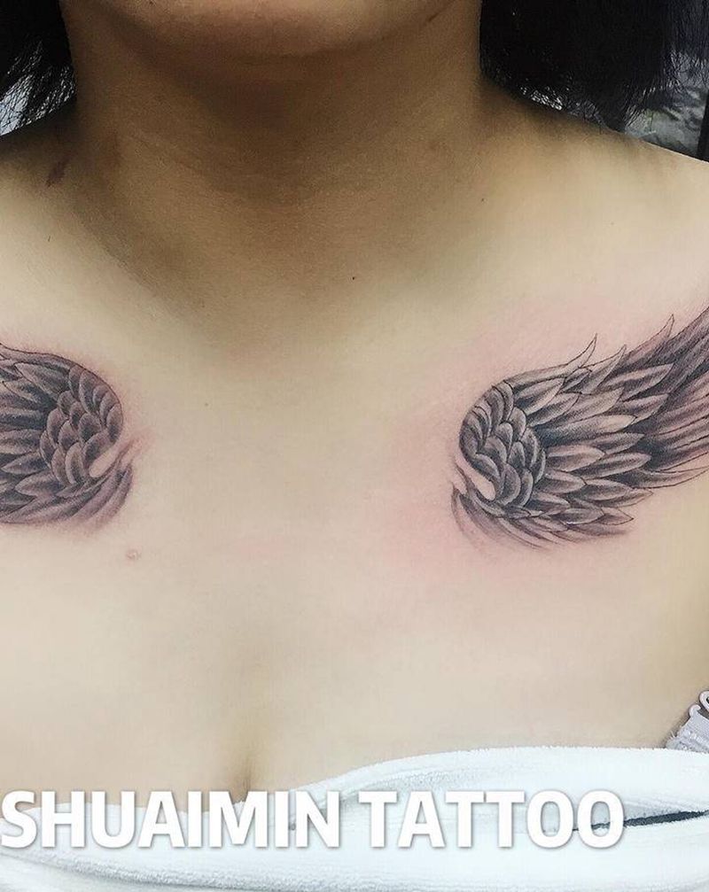 翅膀纹身图片_胸部纹身图案