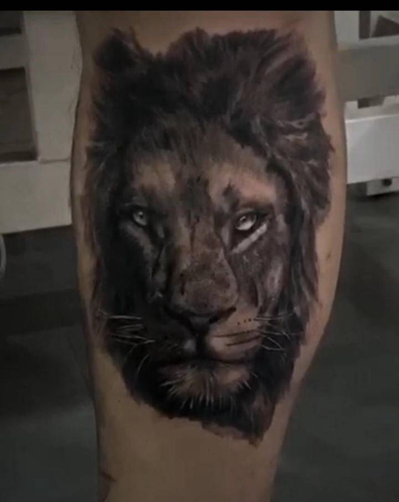 欧美写实狮子纹身图片_腿部纹身图案