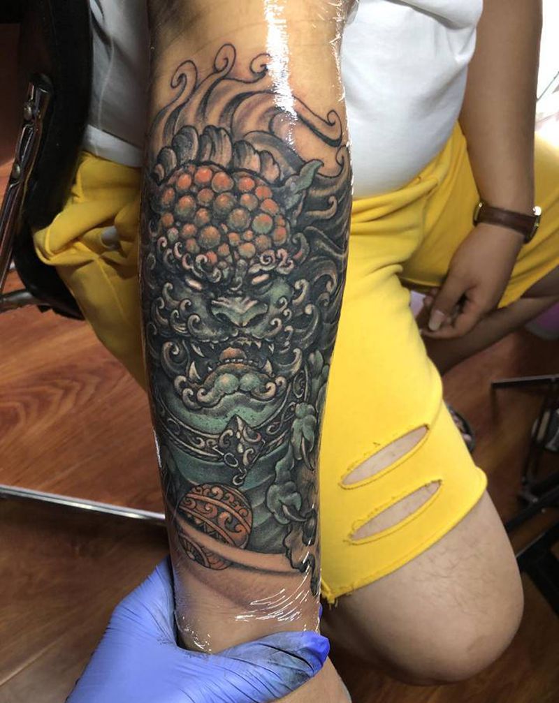 唐狮遮盖失败老纹身纹身图片_手臂新传统唐狮纹身图案