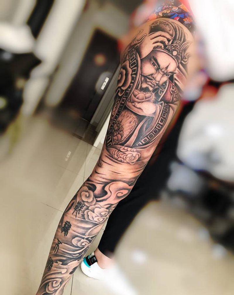 财神花腿纹身图片_腿部新传统纹身图案