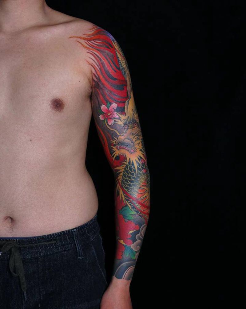 花臂龙纹身图片_手臂新传统纹身图案