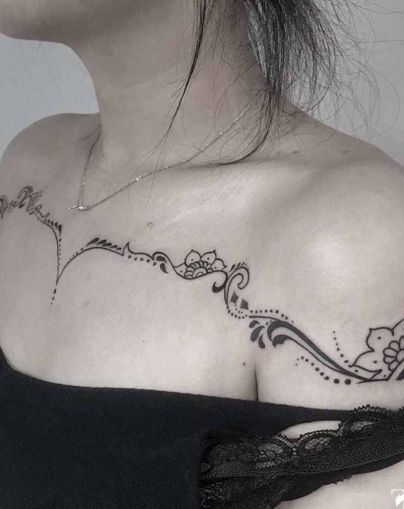 美爆炸纹身图片_胸部肩部点刺几何纹身图案