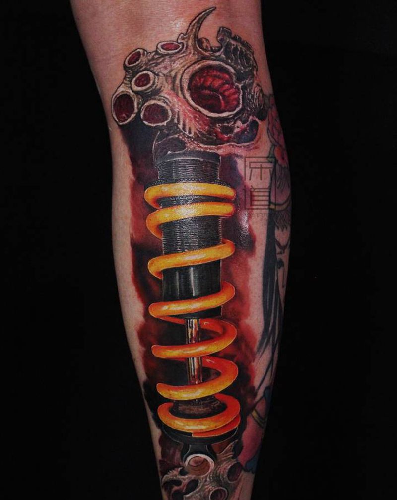 乐道欧美彩色叠彩机械腿纹身图片_腿部脚部欧美写实机械腿减震臂乐道刺青纹身图案