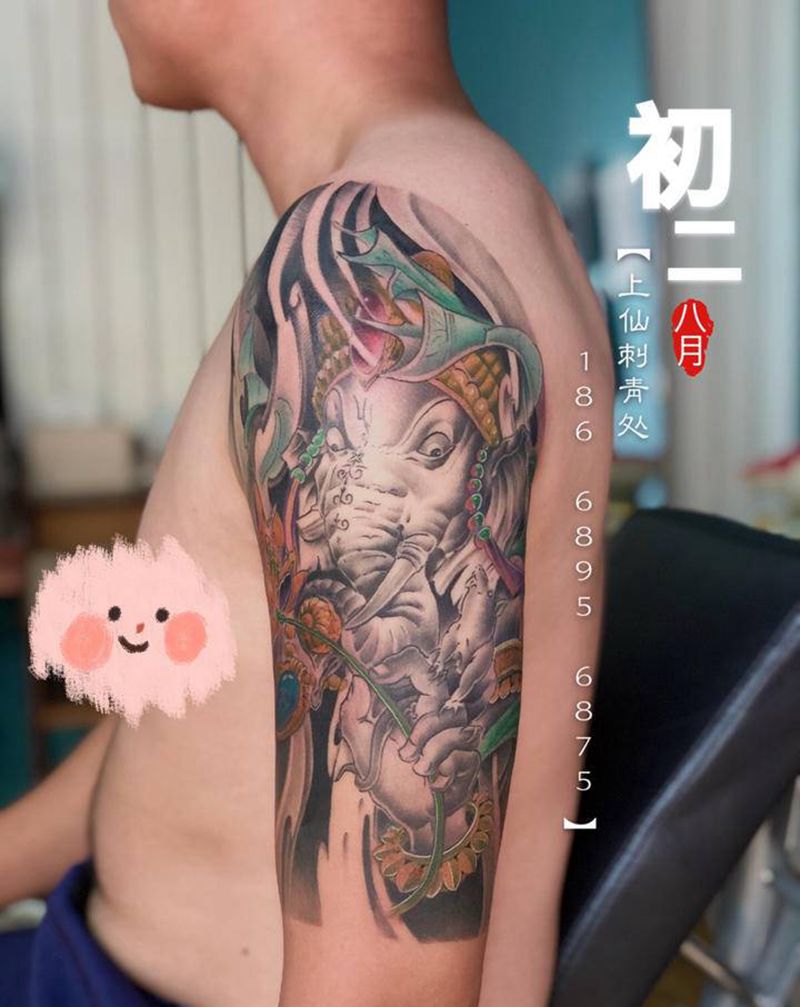 象神纹身图片_手臂肩部新传统欧美写实象神纹身图案