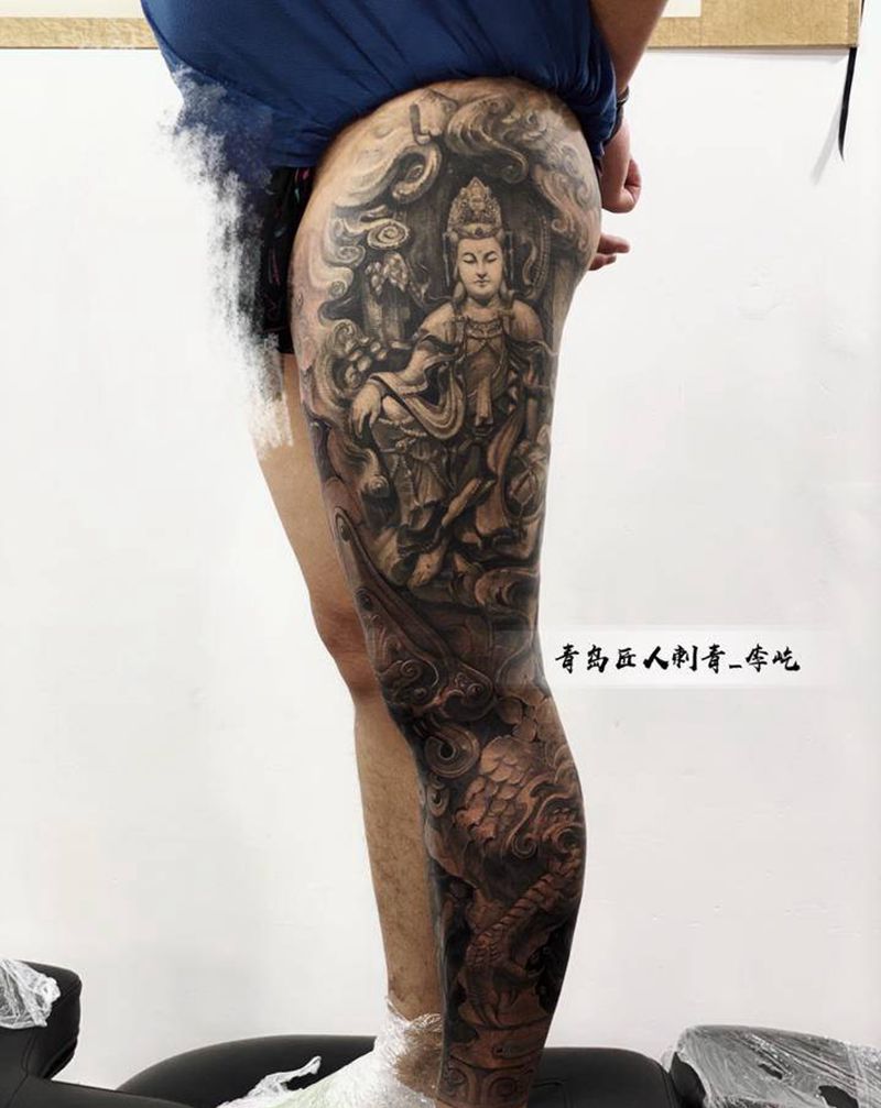 石雕花腿 大势至菩萨纹身图片_腿部新传统欧美写实大势至菩萨石雕龙纹身图案