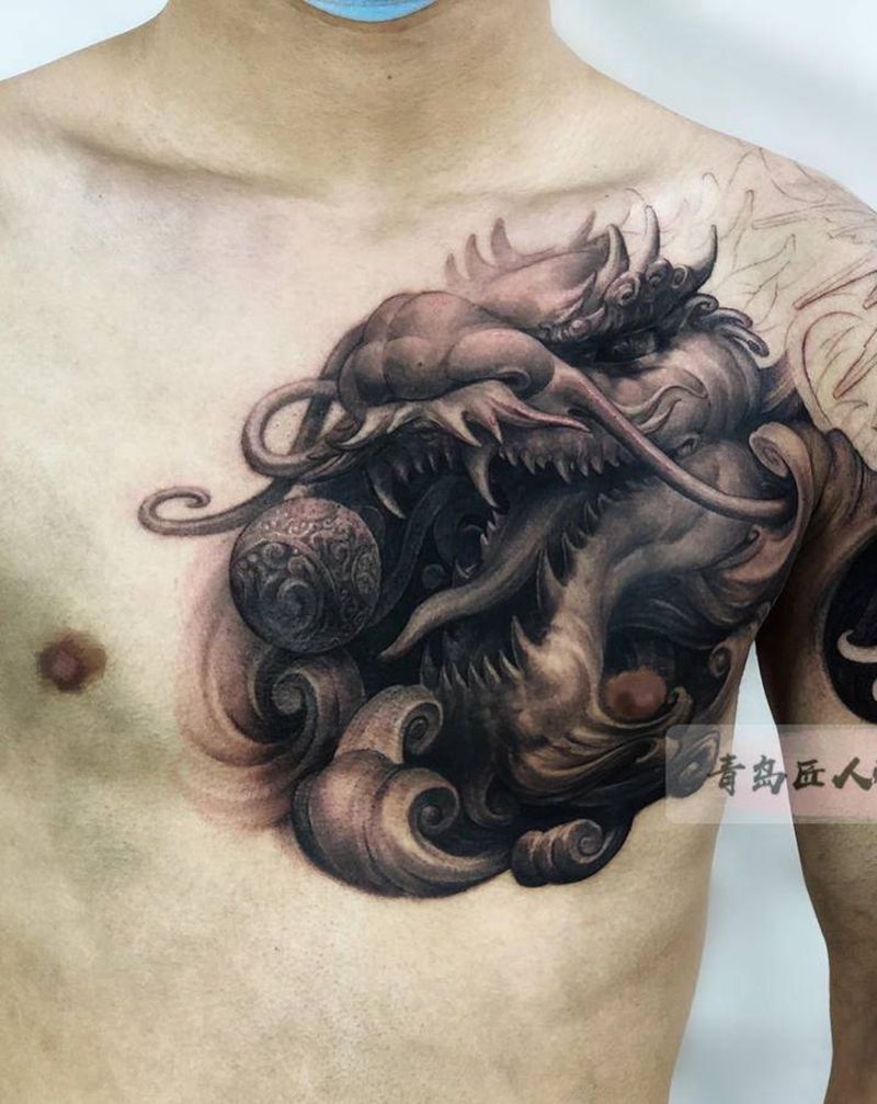 石雕龙 半甲龙纹身图片_胸部手臂欧美写实新传统龙石雕纹身图案