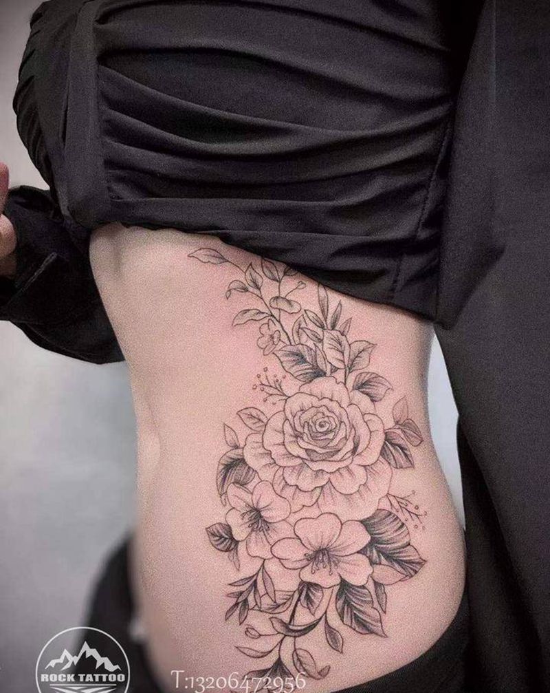 侧腰素花纹身图片_腰部点刺水墨素花腰部纹身图案