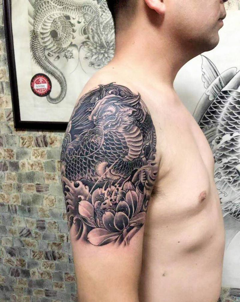 麒麟配荷花纹身图片_手臂新传统纹身图案