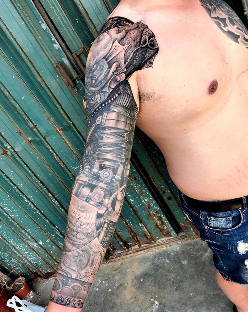 雕龙臂纹身图片_手臂欧美写实石雕机械纹身图案