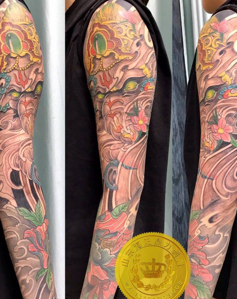 DL 衔接花臂打雾纹身图片_手臂老传统纹身图案