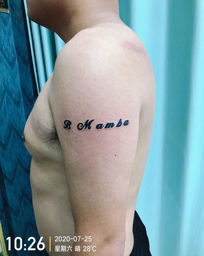 DL 大臂字母控纹身图片_手臂老传统纹身图案