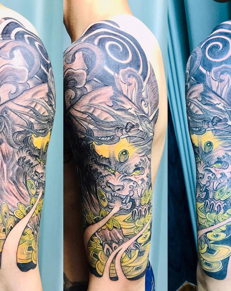 DL大臂貔貅打雾纹身图片_手臂老传统纹身图案