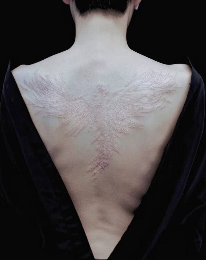 • 破碎重生  凤凰涅槃 •纹身图片_背部几何纹身图案