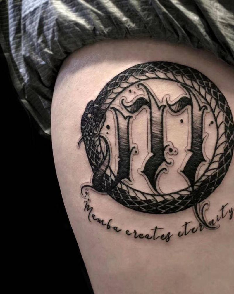 黑曼巴纹身图片_腿部纹身图案