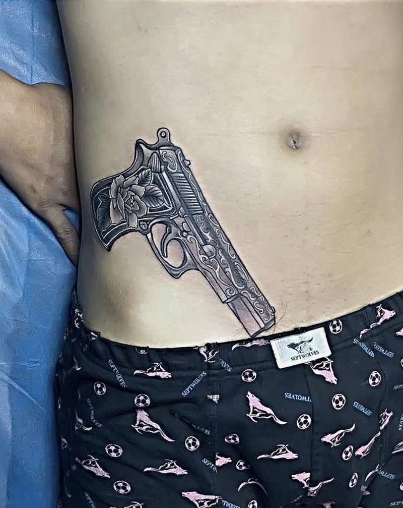 枪纹身图片_腰部新传统纹身图案