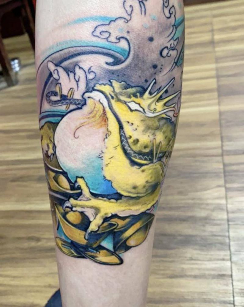 金蟾纹身图片_腿部纹身图案