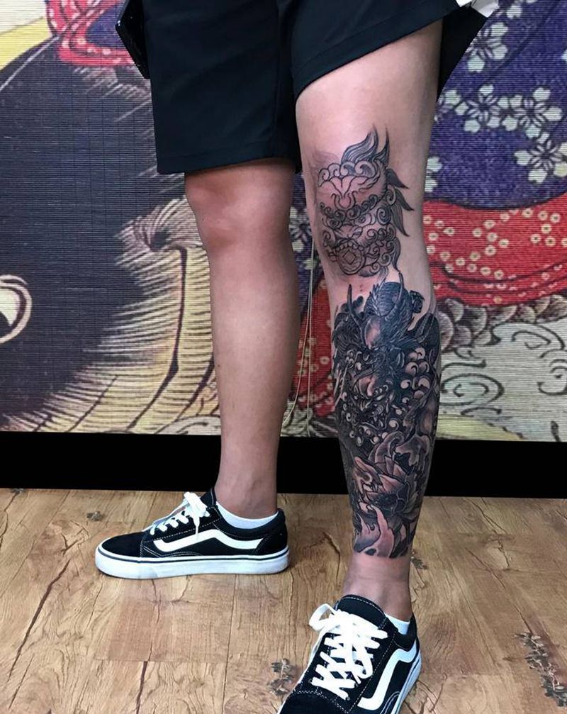 进度纹身图片_腿部新传统唐狮龙纹身图案