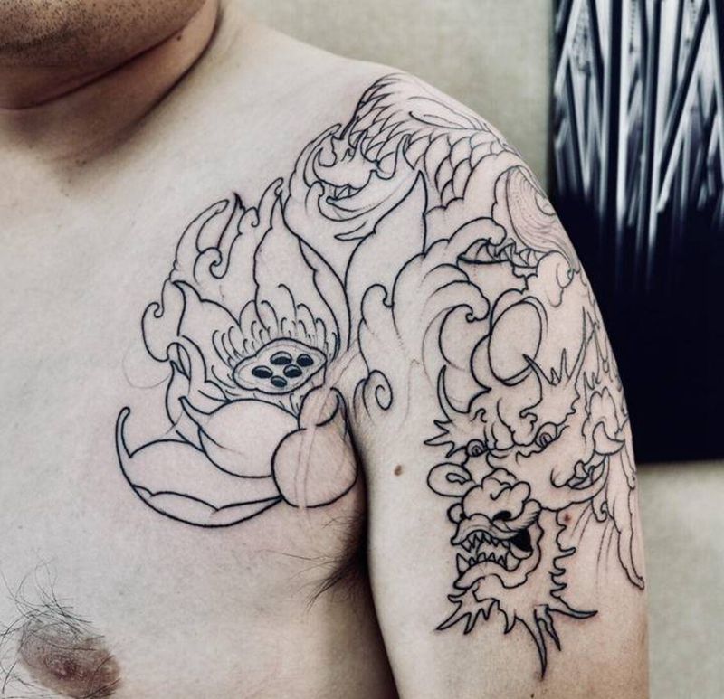 半胛纹身图片_胸部手臂新传统龙莲花纹身图案