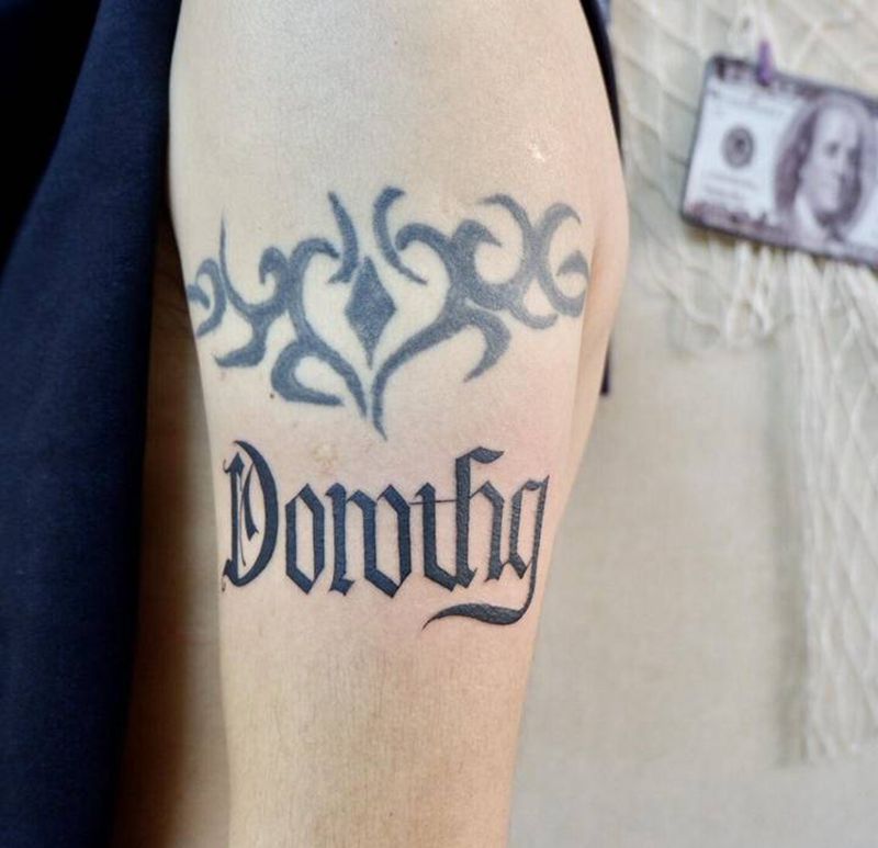 上帝的礼物纹身图片_手臂花体字上帝的礼物花体字纹身图案