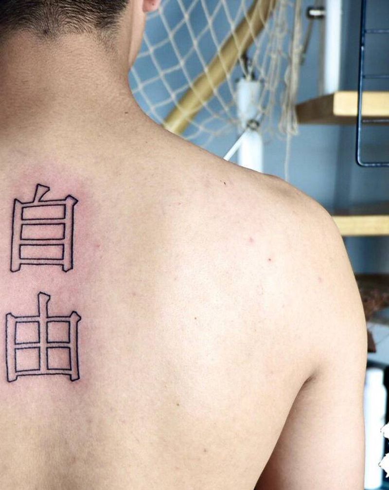 自由纹身图片_背部图腾纹身图案