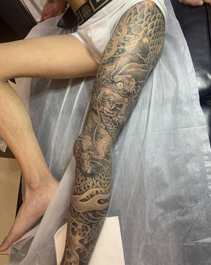 卧龙纹身图片_腿部新传统纹身图案