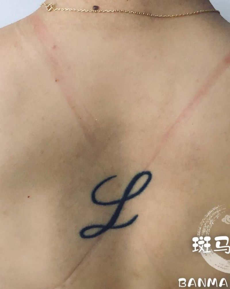 月牙遮盖旧图纹身图片_背部纹身图案