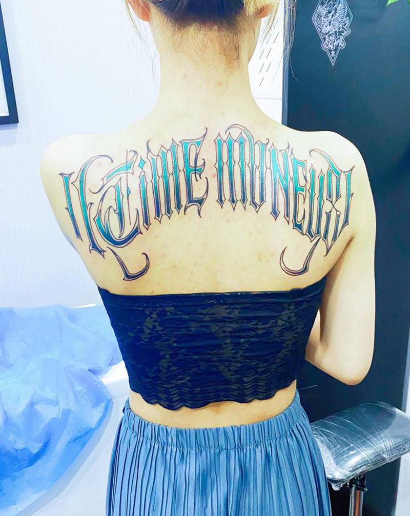 时间与金钱纹身图片_背部纹身图案