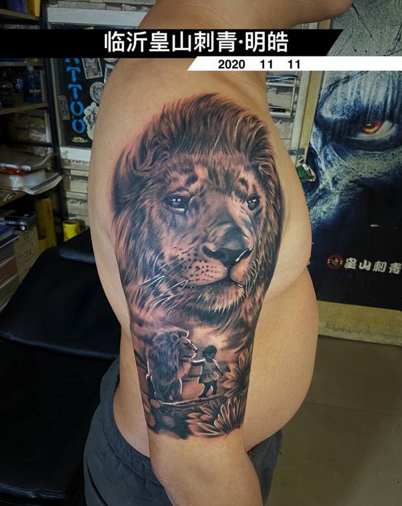 雄狮纹身图片_手臂欧美写实纹身图案