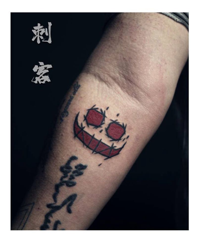 鬼脸纹身图片_手臂纹身图案