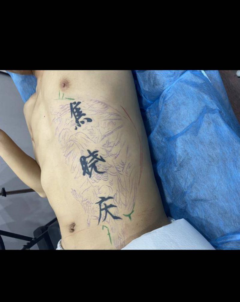 遮盖纹身图片_腹部纹身图案