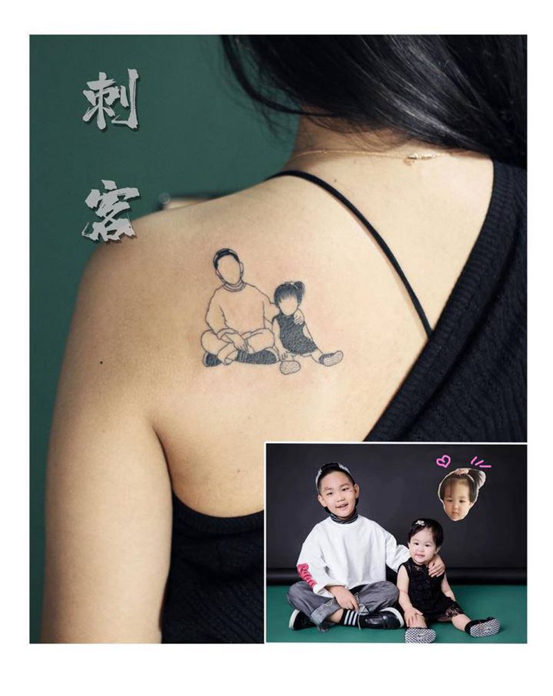 儿女剪影风纹身图片_肩部纹身图案