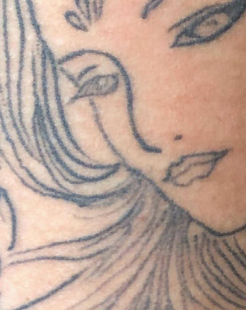 修改面目全非的姑娘纹身图片_手臂纹身图案