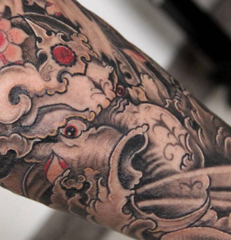 传统象神包小腿局部纹身图片_腿部新传统点刺纹身图案