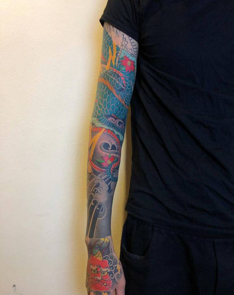 未完纹身图片_手臂老传统纹身图案