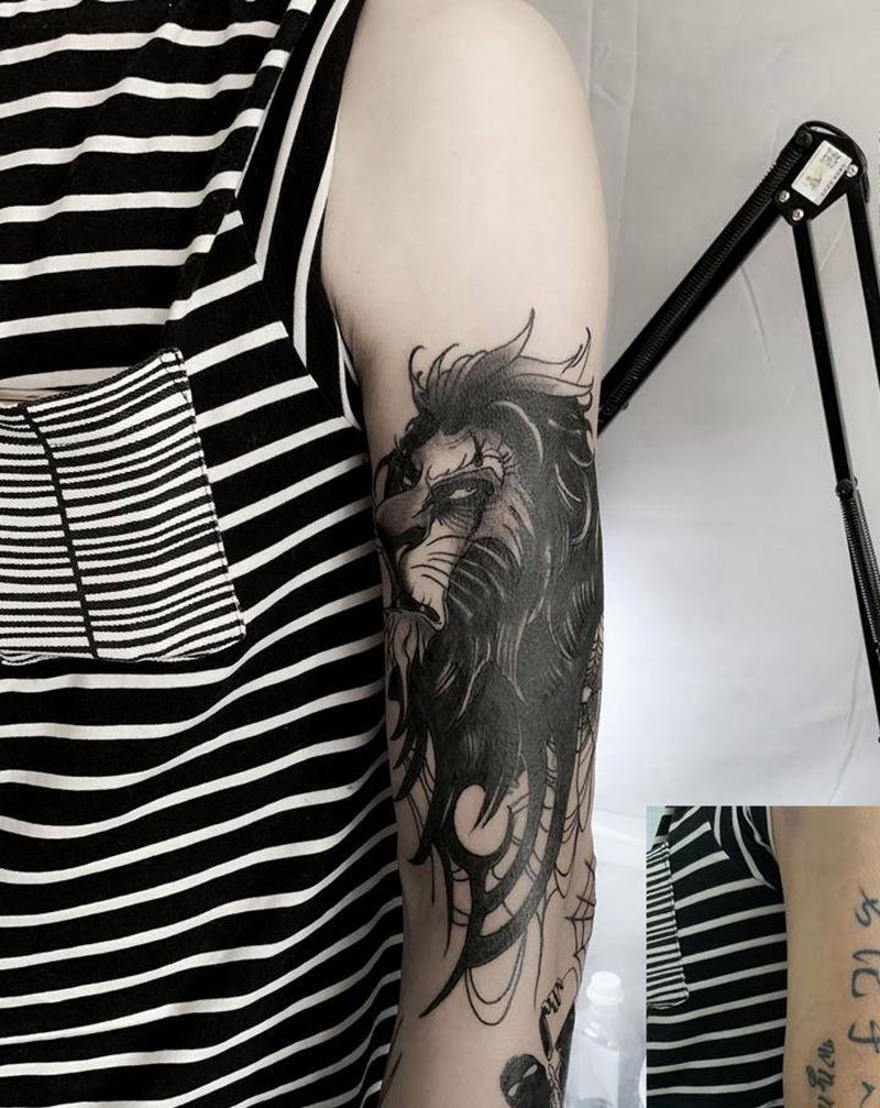 狮子遮盖纹身图片_手臂纹身图案